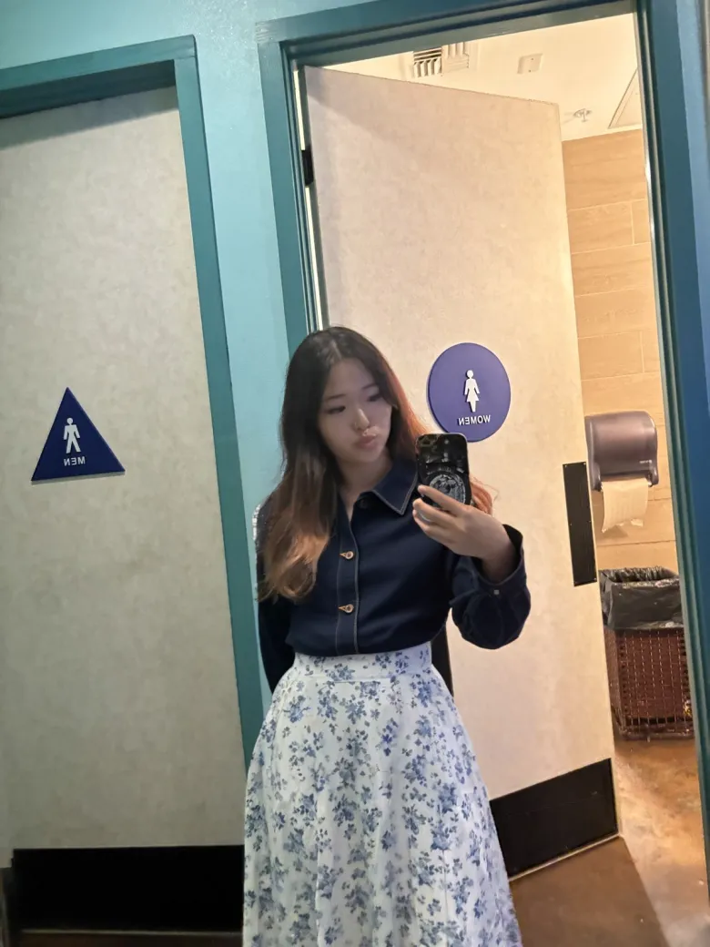 Yuni wearing the blue floral midi and denim jacket
